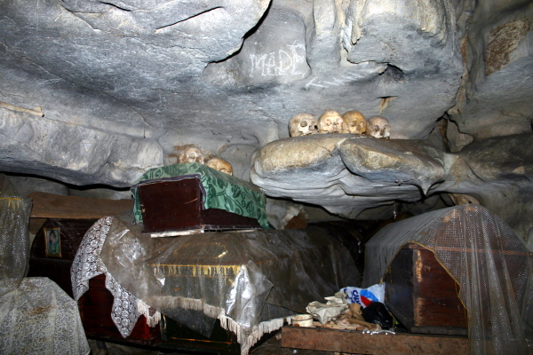 Coffins and skulls in the cave at Londa